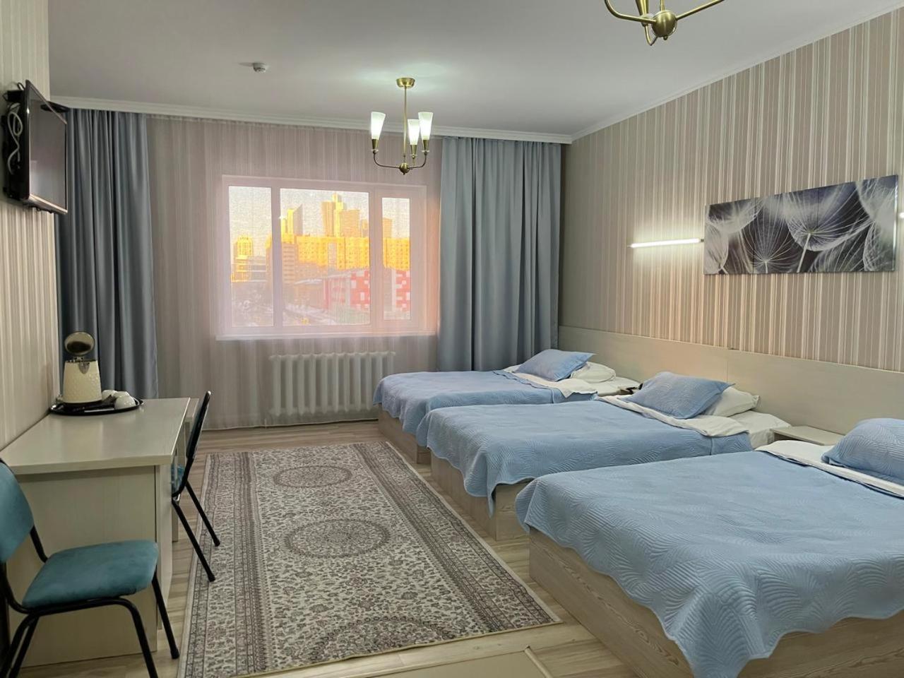 Union Plaza Hotel Astana Bagian luar foto