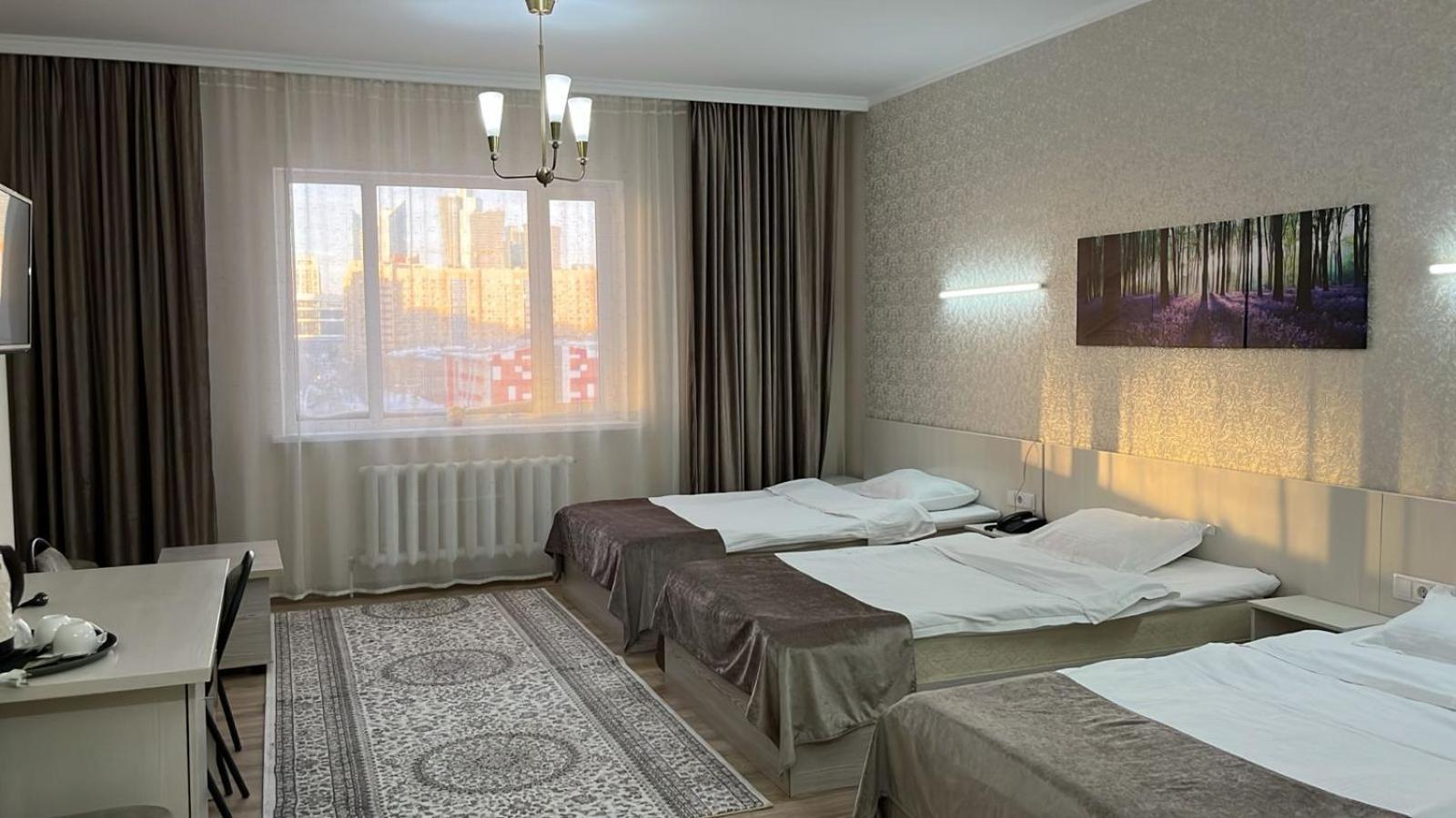 Union Plaza Hotel Astana Bagian luar foto